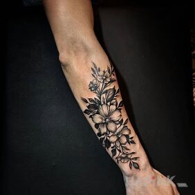 Tattoo Flora on the forearm motif: black and gray style: graphic / illustrative
