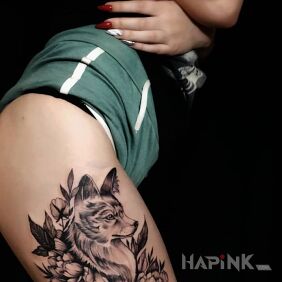 Tattoo Fox in flower on the leg motif: flowers style: graphic / illustrative
