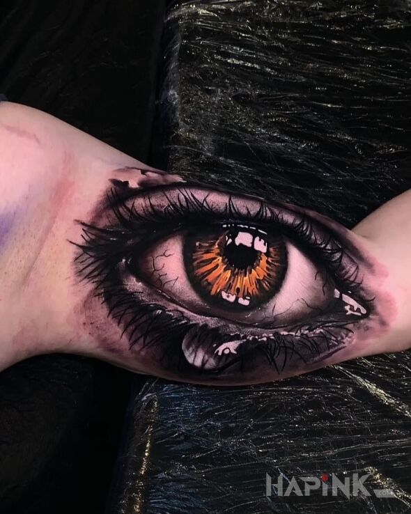 Tattoo Mega oko in 3D motif and realistic style on the upper arm
