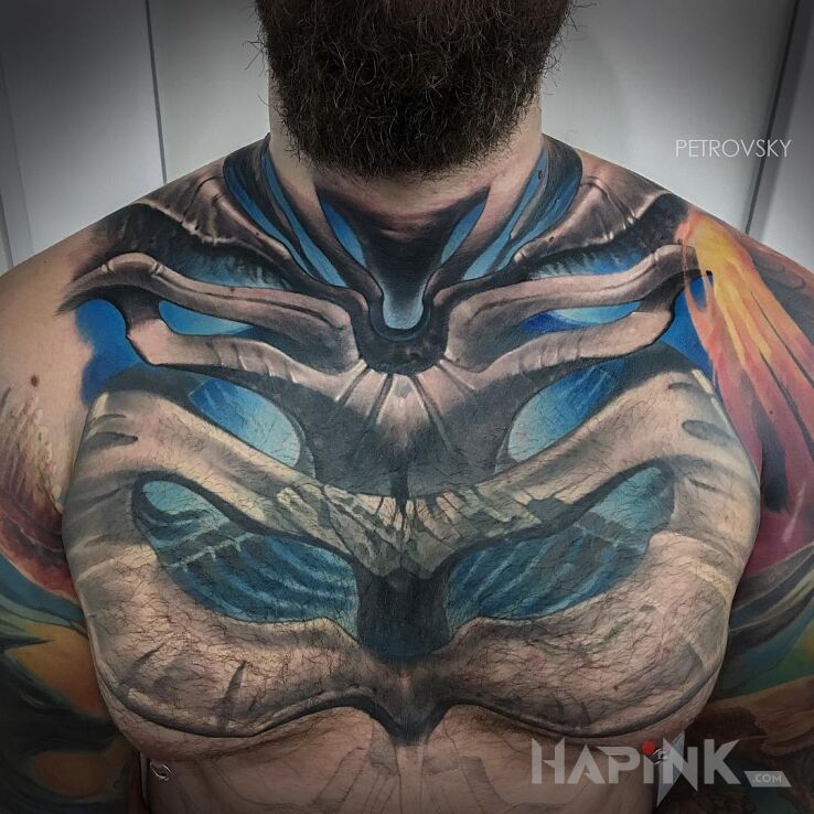 Tattoo Kościasty in colorful motif and organic style on the collarbone