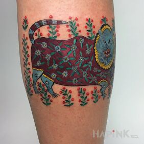 Tattoo Folk cat on the forearm motif: colorful style: graphic / illustrative