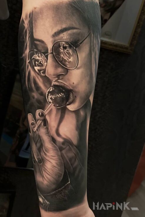 Tattoo Lizaczek in faces motif and realistic style on the forearm