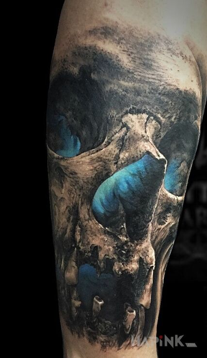 Tattoo Niebieskie prześwity in black and gray motif and realistic style on the forearm