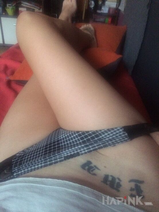 Tattoo Ewcia in lettering motif and minimalistic style on the stomach