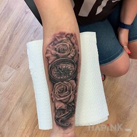 Tattoo A wind rose surrounded by roses. ? on the forearm motif: Love style: realistic