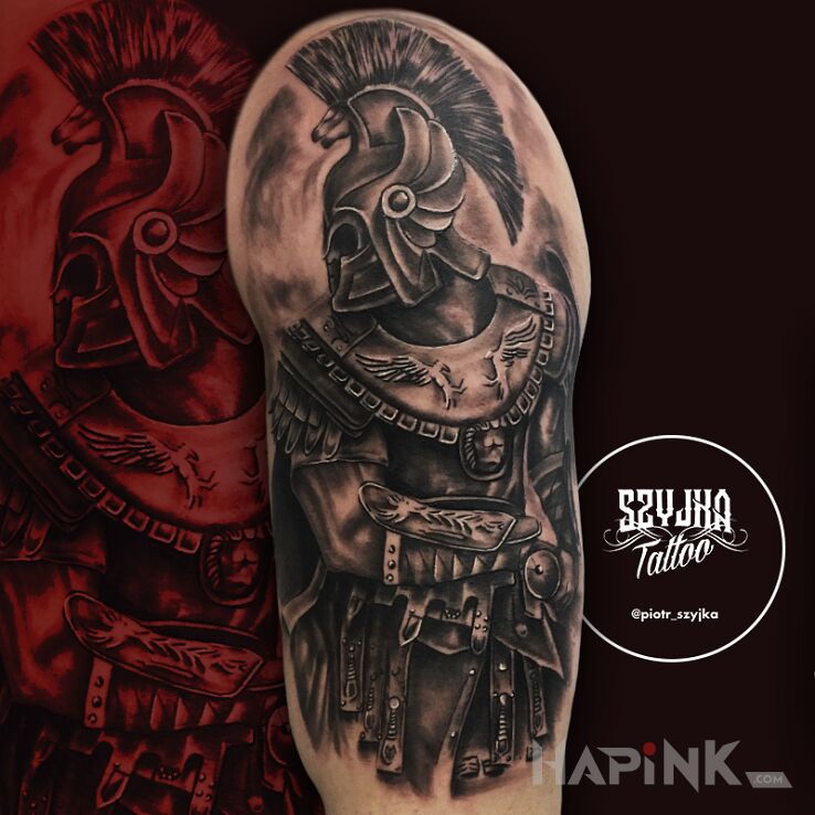 Tattoo Wojownik in black and gray motif and realistic style on the upper arm
