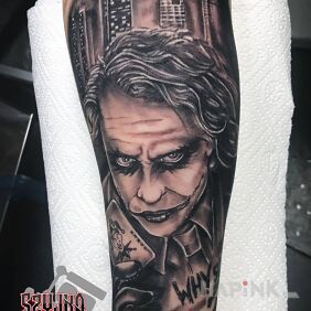 Tattoo Joker ? on the forearm motif: black and gray style: realistic