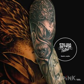 Tattoo Nature on the upper arm motif: black and gray style: realistic