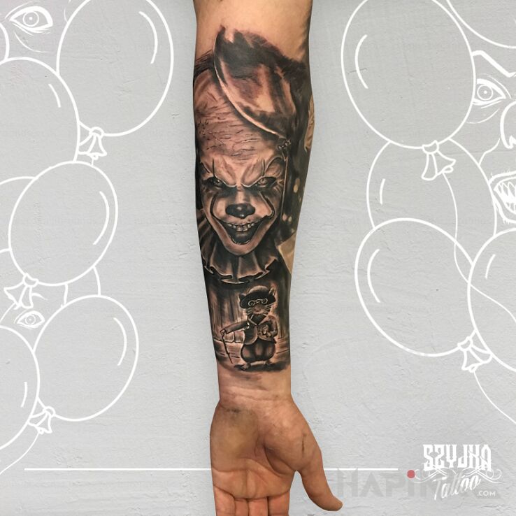 Tattoo It Movie. in faces motif and realistic style on the forearm