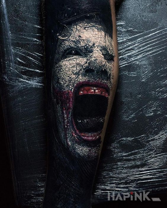 Tattoo Krzyk in demons motif and realistic style on the forearm