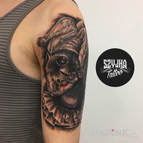Tattoo Stańczyk and Jason from Friday the 13th ego ? on the upper arm motif: demons style: realistic