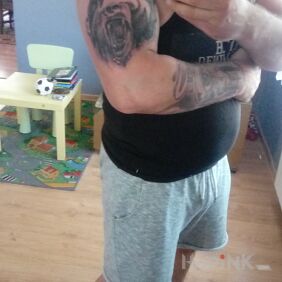 Tattoo Bear on the upper arm motif: animals style: realistic