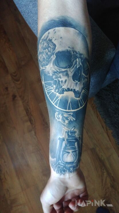 Tattoo Czacha in objects motif and realistic style on the forearm