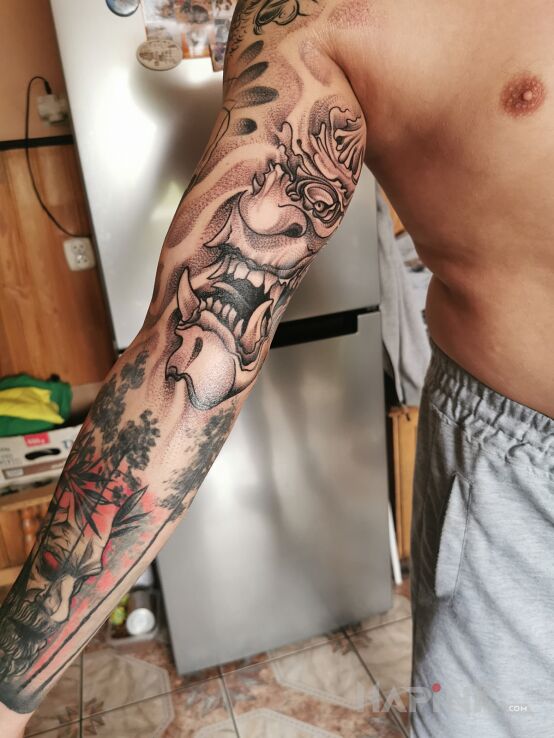Tattoo Demony in sleeves motif and dotwork style on the forearm