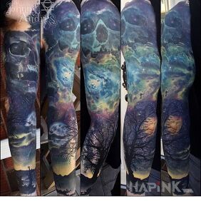 Tattoo Skulls and Sky on the upper arm motif: colorful style: realistic