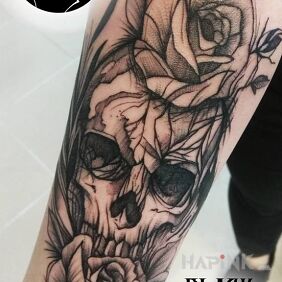 Tattoo A flower-covered skull on the forearm motif: skulls style: sketch