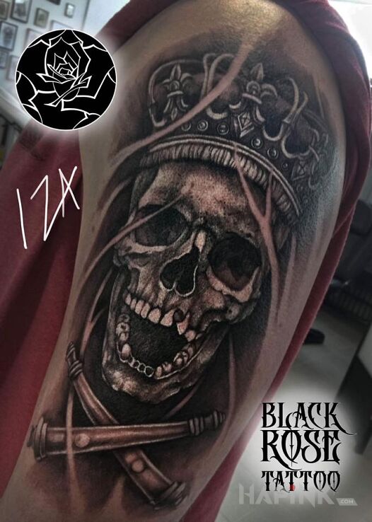 Tattoo Czacha in black and gray motif and realistic style on the upper arm