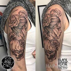 Tattoo Woman on the upper arm motif: faces style: graphic / illustrative