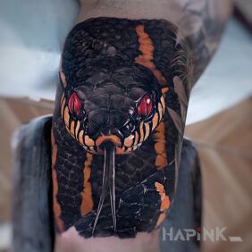 Tattoo Red snake eyes on the upper arm motif: 3D style: realistic