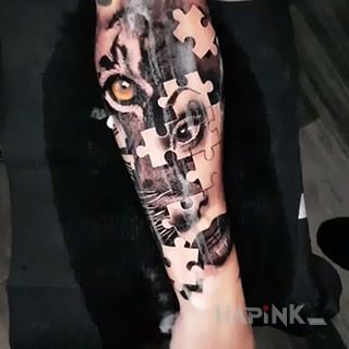 Tattoo Tiger Eye in black and gray motif and realistic style on the forearm