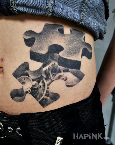 Tattoo Puzzle / Tryby in black and gray motif and realistic style on the stomach