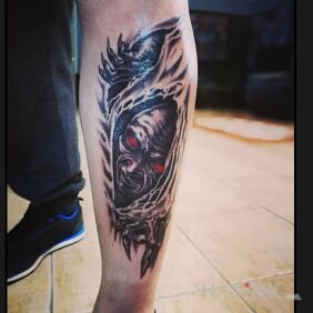 Tattoo Demon on the calf motif: faces style: graphic / illustrative
