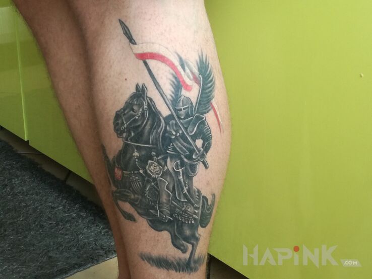 Tattoo Husaria in animals motif and graphic / illustrative style on the calf