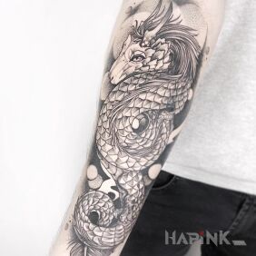 Tattoo Fairy tale dragon on the forearm motif: dragons style: graphic / illustrative