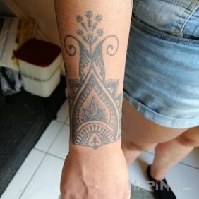 Tattoo Tattoo on the forearm motif: black and gray style: graphic / illustrative