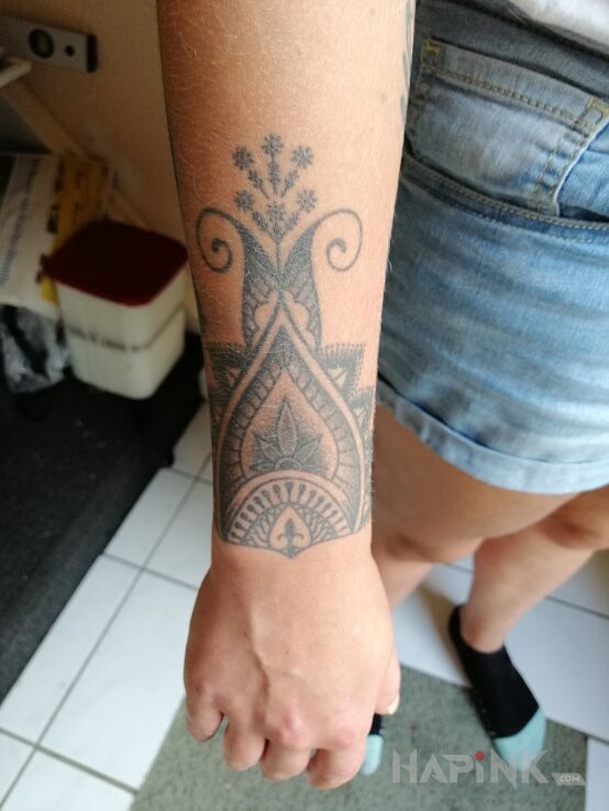 Tattoo Tattoo in black and gray motif and graphic / illustrative style on the forearm
