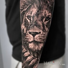 Tattoo Lion on the forearm motif: zodiac signs style: realistic