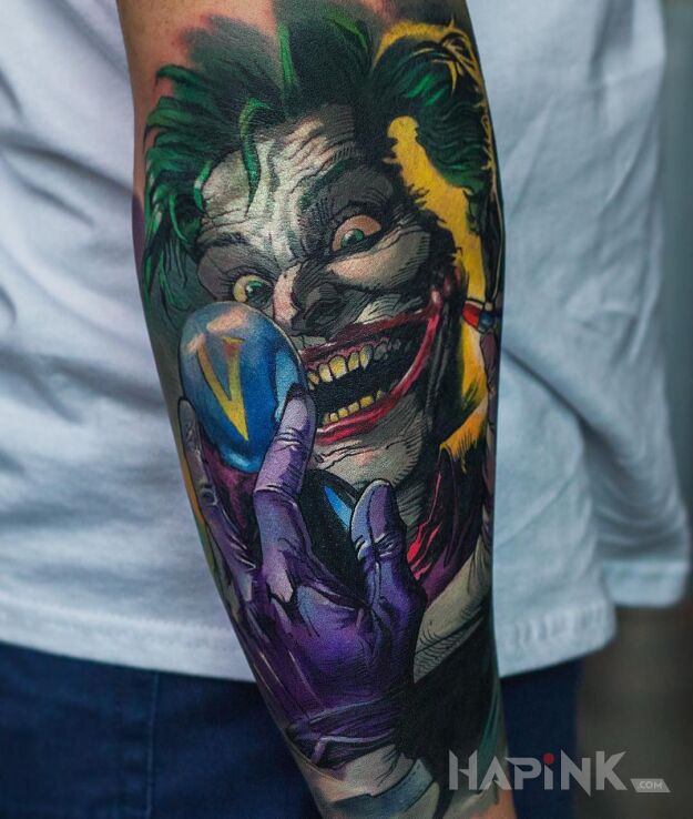Tattoo Komiksowy Joker in faces motif and cartoon / comic book style on the forearm