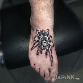 Tattoo Arachnid on the foot motif: black and gray style: realistic