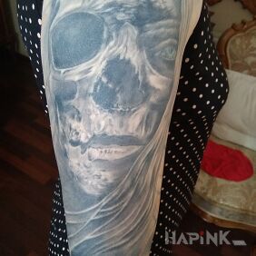 Tattoo Others on the upper arm motif: faces style: realistic