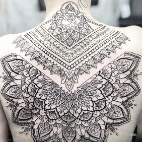 Tattoo Madale on the back motif: black and gray style: geometric