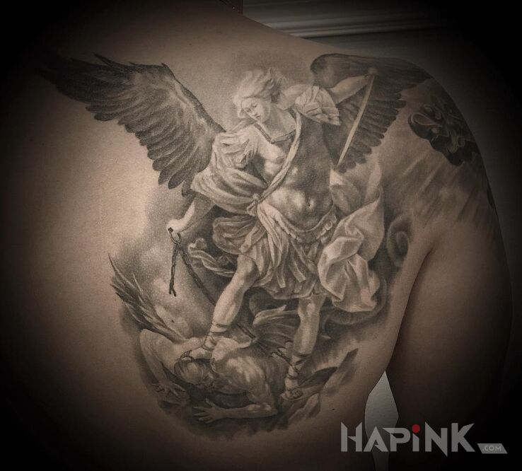 Tattoo Archanioł in religious motif and realistic style on the shoulder blades