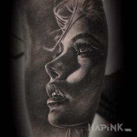 Tattoo Portrait of a woman on the upper arm motif: faces style: realistic