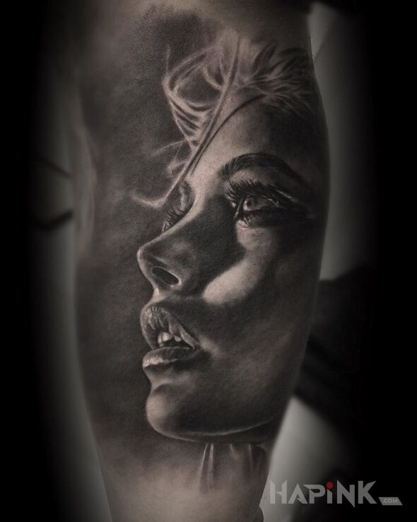 Tattoo Portret kobiety in faces motif and realistic style on the upper arm
