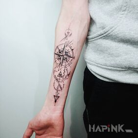 Tattoo Wind rose on the forearm motif: black and gray style: graphic / illustrative