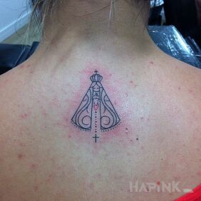 Tattoo Mother of God on the back motif: religious