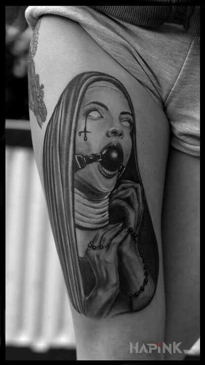 Tattoo Taka inna zakonnica :) in faces motif and realistic style on the leg