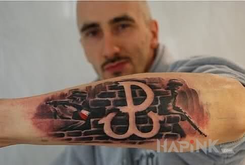 Tattoo Polska walcząca in patriotic motif on the forearm