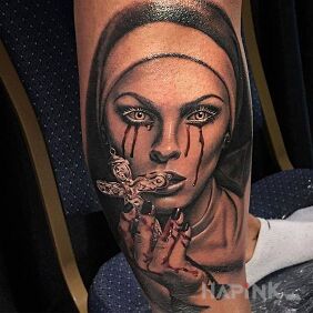 Tattoo Nun with a cross on the calf motif: faces style: realistic