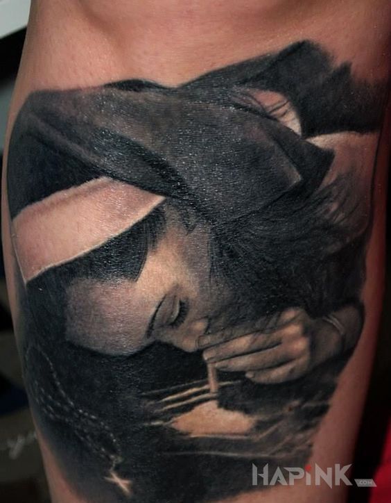 Tattoo Proszek w nos in black and gray motif and realistic style on the leg