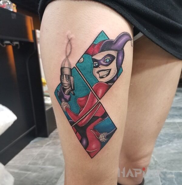 Tattoo Harley Quinn z kreskówki in colorful motif and cartoon / comic book style on the leg