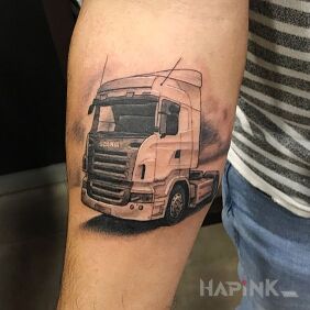 Tattoo TIR on the forearm motif: motorization style: realistic