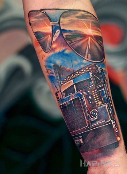Tattoo Słoneczna trasa in motorization motif and realistic style On the arm