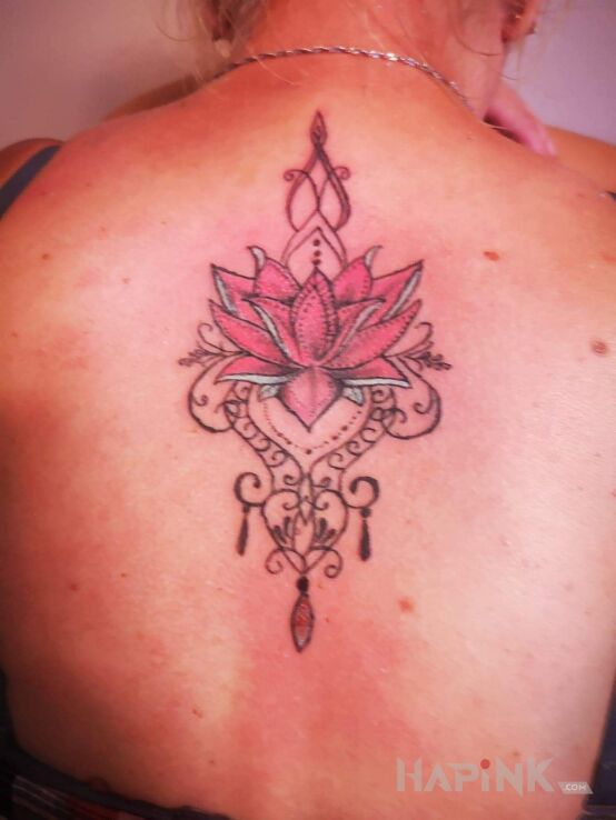 Tattoo Mandala in ornaments motif and graphic / illustrative style on the back