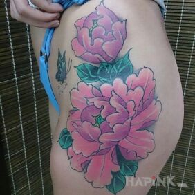 Tattoo Pink flowers on the leg motif: colorful