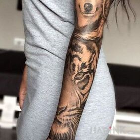 Tattoo The Wolf and the Tiger on the forearm motif: flowers style: realistic